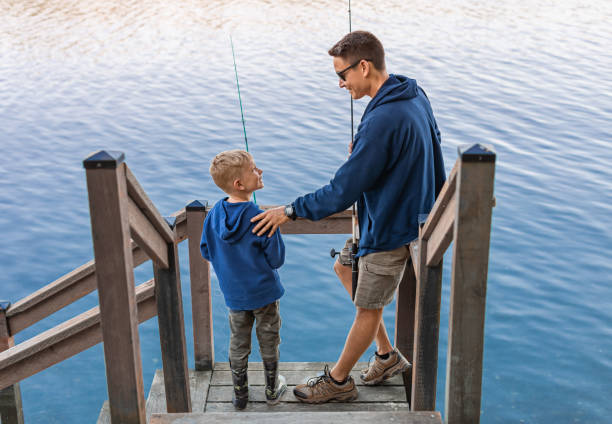 Father and son enjoying fishing together.
