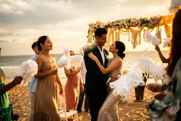 istock Bride and groom in wedding ceremony on the beach 1933373569