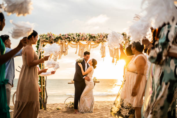 istock Bride and groom in wedding ceremony on the beach 1933373573