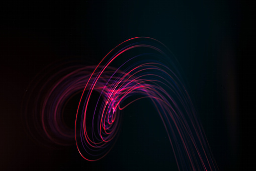Red and purple neon light creating a swirling vortex effect.