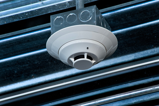 Smoke detector installed in an industrial setting.