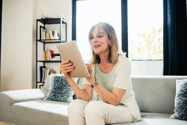 istock Mature woman using digital tablet 1933549020