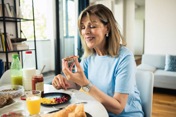 istock Woman is enjoying breakfast 1933550529