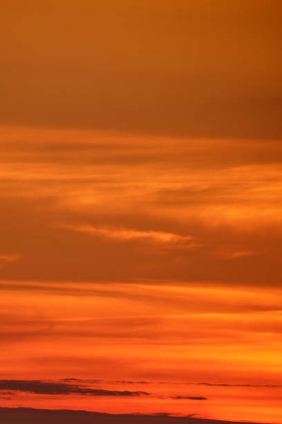 istock Sunset sky with orange clouds in the evening. Natural background. 1933555602