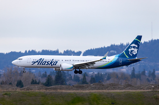 Portland, Oregon, USA - January 1, 2024: An Alaska Airlines Boeing 737 MAX-9, with registration number N982AK, comes in for landing at Portland International Airport.