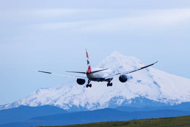 Portland, Oregon, USA - January 1, 2024: A British Airways Boeing 787-9 Dreamliner, direct from London Heathrow, comes in for landing at Portland International with Mt Hood in the background.