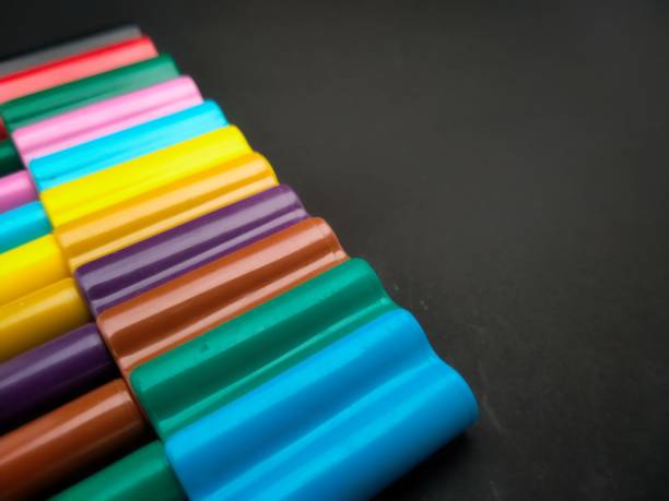 istock Colorful markers on a dark background, for space text 1933642003