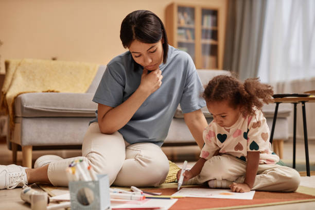 Mom Watching Preschool Daughter Drawing