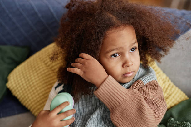 istock Little Girl Combing Hair 1933657531