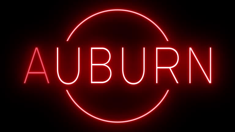 Glowing and blinking red retro neon sign for AUBURN