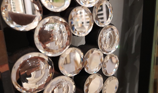 glass rim ornament with small diamond motifs. Small round diamonds closeup detail background