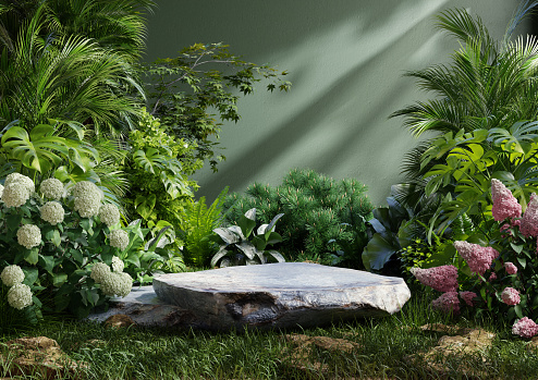 Product presentation with a rock podium set amidst a lush tropical forest and flower,enhanced by a vibrant green backdrop- 3D rendering