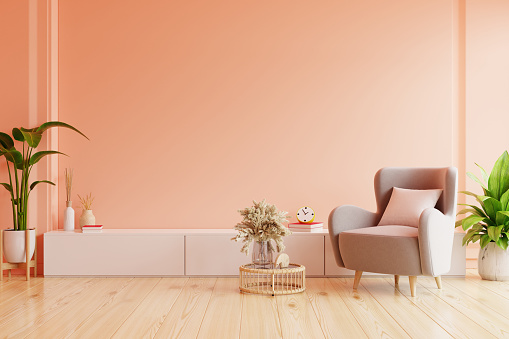 Modern living room. peach fuzz room have peach armchair with peach color paint wall- 3D rendering