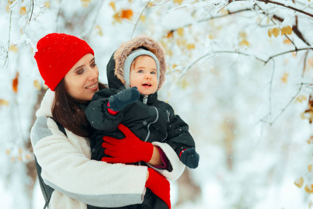 istock Happy Baby Being Curious about the Snow Laughing 1933775285