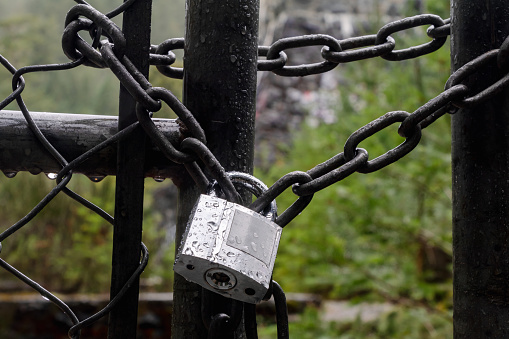 Love locks hanging in bridge with heart shaped padlock - symbol of of love, friendship and romance, Paris, France