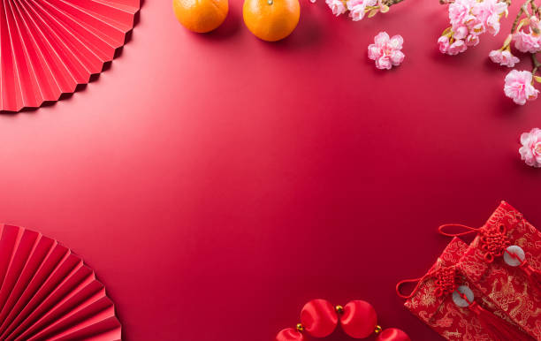 istock Chinese new year decorations background concept made from red packet, orange and plum blossom. 1933816761