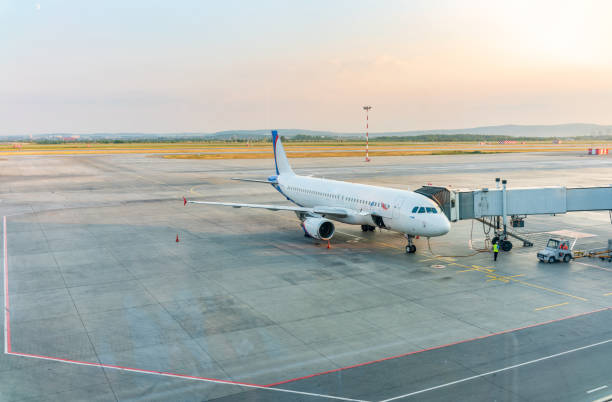 istock The gate sleeve is docked to the aircraft. 1933838123