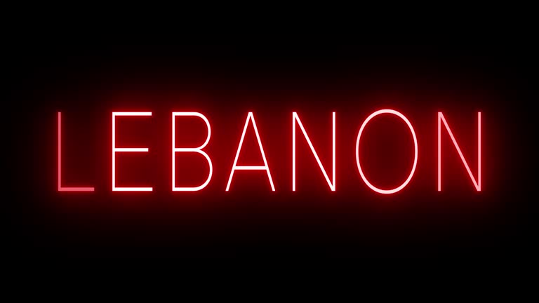 Glowing and blinking red retro neon sign for LEBANON