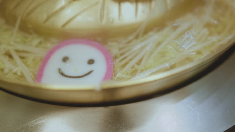 Close-up shot smile meatball Shabu Shabu (Sukiyaki) in hot pot restaurant lifestyle concept.