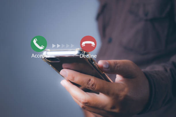 istock Man Answering the Unknown Caller on a Mobile Smartphone. Incoming Call. 1933915357