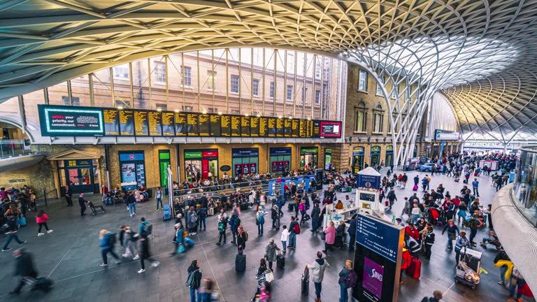 Time lapse of Crowded Commuter people in Kings Cross Station in downtown district of London United Kingdom,