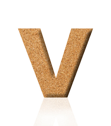 Close-up of three-dimensional cork alphabet letter V on white background.