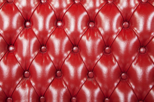istock Details of red textured leather sofa with buttons 1934041458