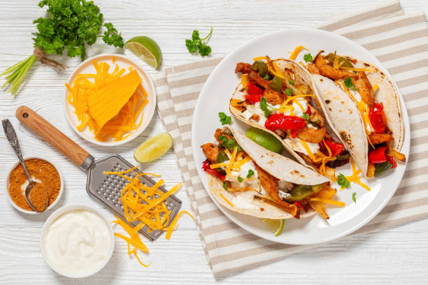istock baked tex-mex chicken fajitas on a plate, top view 1934060419
