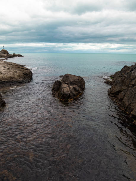 istock Landscape with sea, rocks and cloudy dramatic sky 1934083306