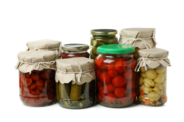 istock Jars of pickled vegetables isolated on white background 1934097855