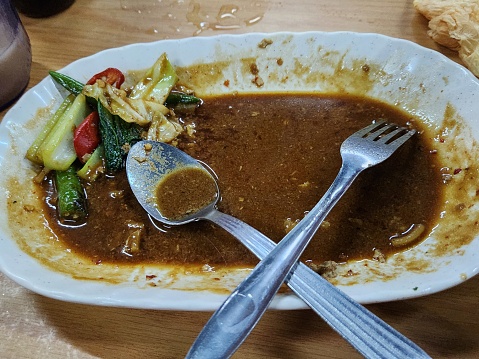 Photo of a Plate after meal with the vegetable put aside. unhealthy diet concept photo