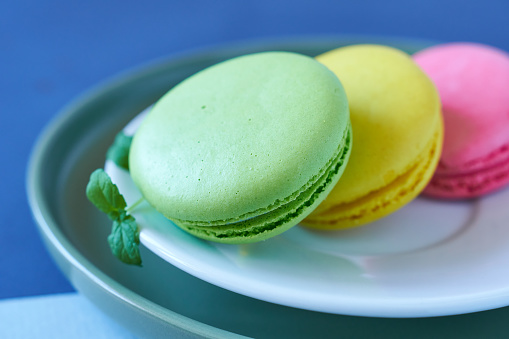 Colorful macaroons on a plate, close-up.