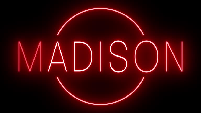 Glowing and blinking red retro neon sign for MADISON