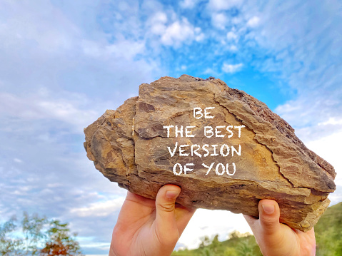 inspirational and motivational quote - be the best version of you written on rock with nature background. Stock photo