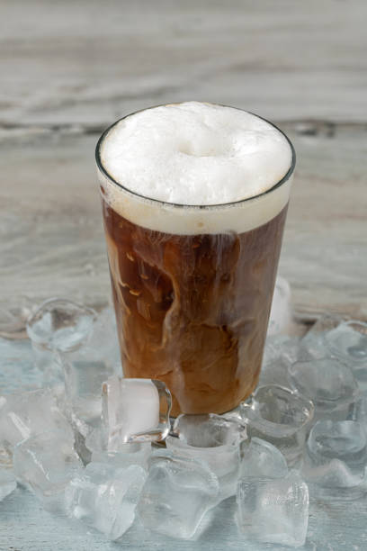 istock Iced coffee latte in glass cup on wooden table 1934197112