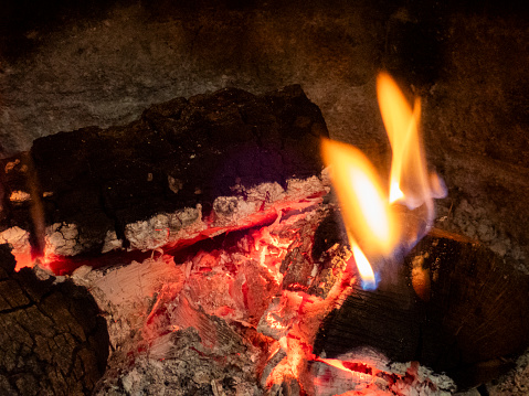 fireplace with fire and wood