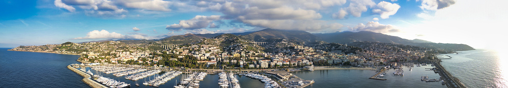 Sanremo, Italy. Aerial view of city port and skyline on a sunny afternoon