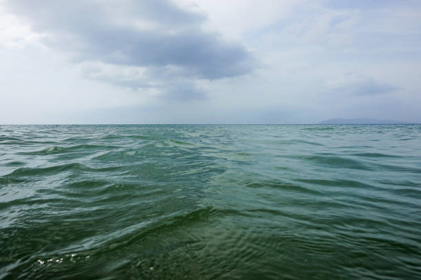 istock calm sea. Blue sea and blue sky background with copy space for your text. 1934234395