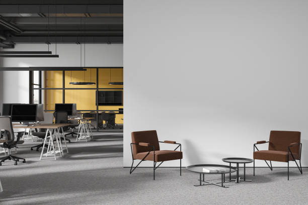 istock White and yellow open space office with armchairs 1934242915