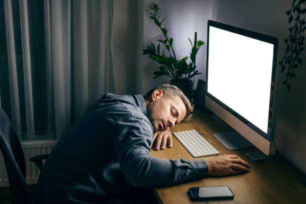 istock A tired entrepreneur is sitting at his home office and sleeping late at night. 1934243421