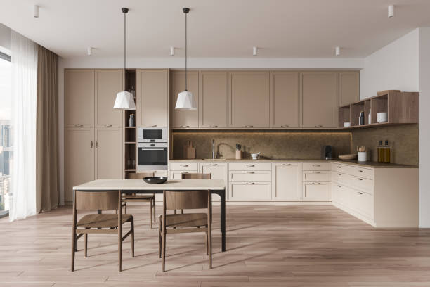 istock Beige luxury home kitchen interior eating table and classical cabinet, window 1934249380
