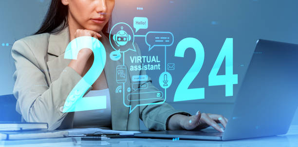 istock Woman working in laptop, virtual assistant hologram with 2024 year and chat bot 1934253013