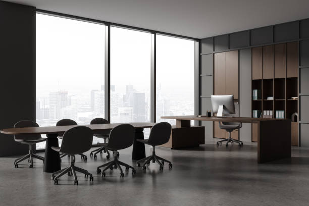 istock Grey modern office interior with table and seats, ceo workspace near window 1934253671