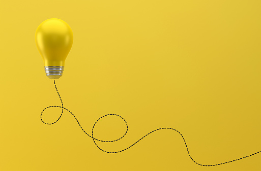 Yellow Light Bulb And Path On Yellow Background