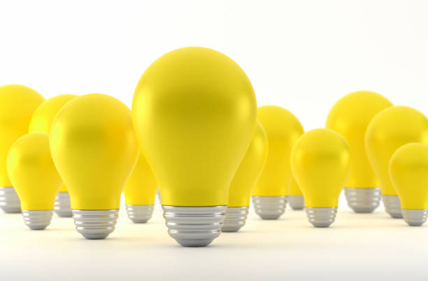 istock Yellow Light Bulb And Standing Out From The Crowd 1934261175