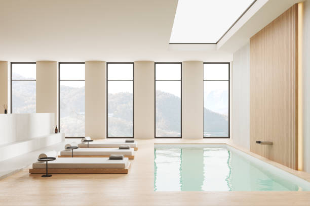 istock Luxury beige spa interior with loungers and panoramic window 1934263347