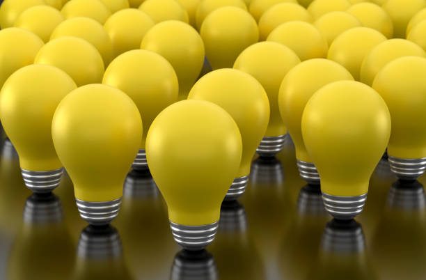 istock Yellow Light Bulb And Standing Out From The Crowd 1934263364
