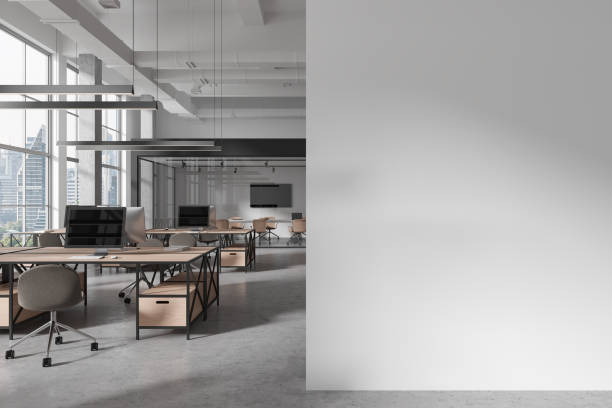 istock White office interior with coworking and meeting space, window. Mock up wall 1934267639