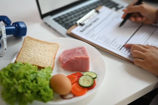 istock Nutritious food with fresh vegetable, meat and egg for healthy diet on white table 1934273685