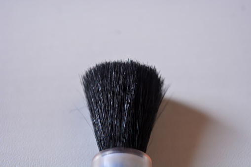 Photo of makeup brush on white background.